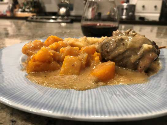 Serving of German Moose Rouladen, served with Butternut Squash and Garlic Mashed Potatoes