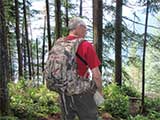 Hiker wearing a Badlands Superday Backpack