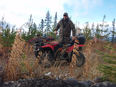 My husband Mark... Moose hunting on his ATV.